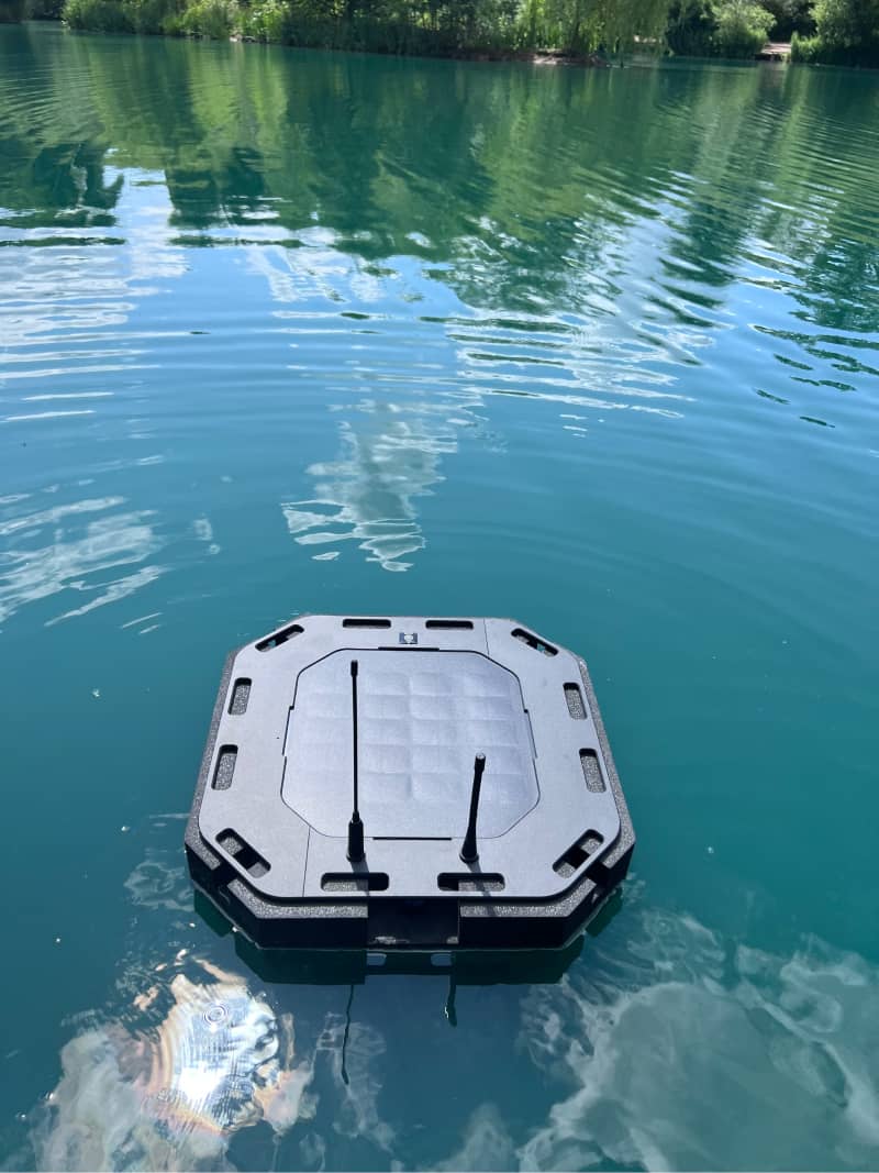 Alternate angle of the WATR Pro unit floating in a lake